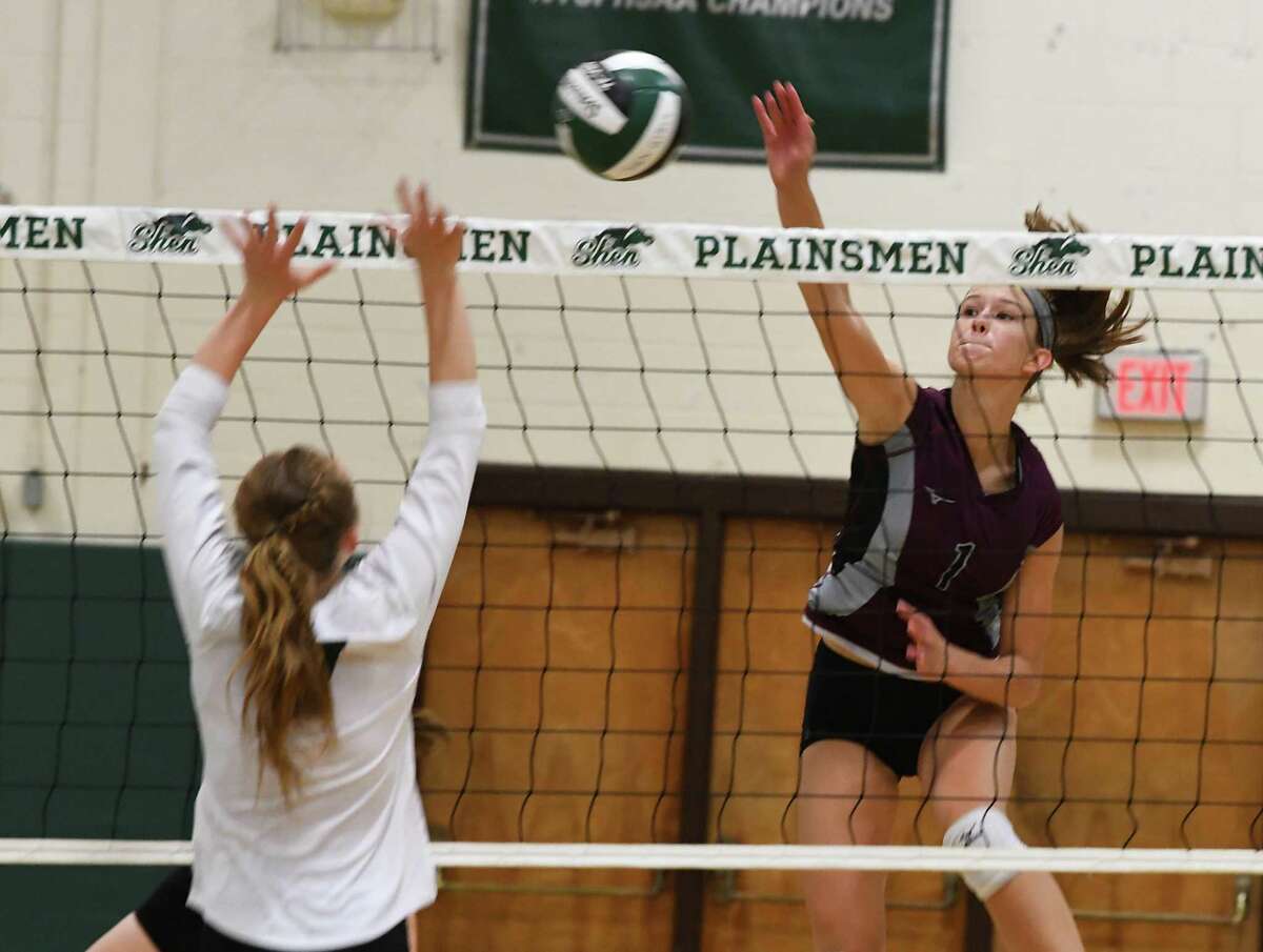 Burnt Hills' Carlie Rzeszotarski, right, spikes the ball past Shenendehowa's Colleen Murphy during a volleyball match on Thursday, Sept. 12, 2019 in Clifton Park, N.Y. (Lori Van Buren/Times Union)
