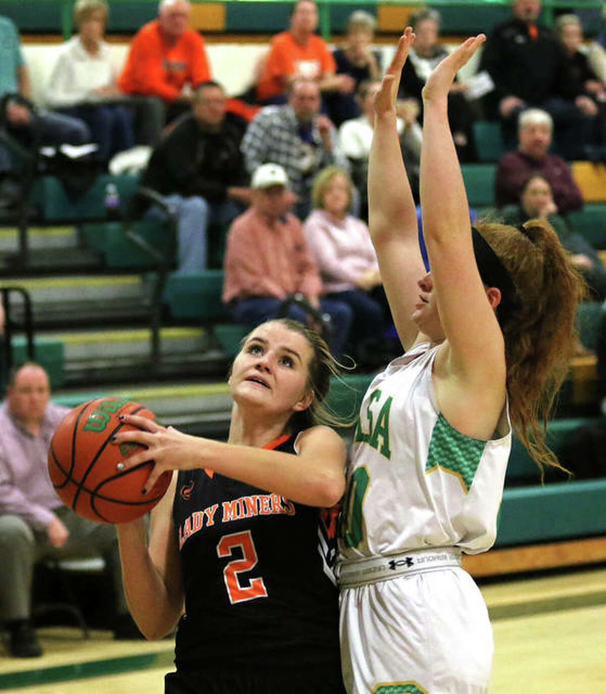 Gillespie’s Hannah Barrett (2) drives on Southwestern’s Rylee Smith for a shot Thursday night in Piasa.