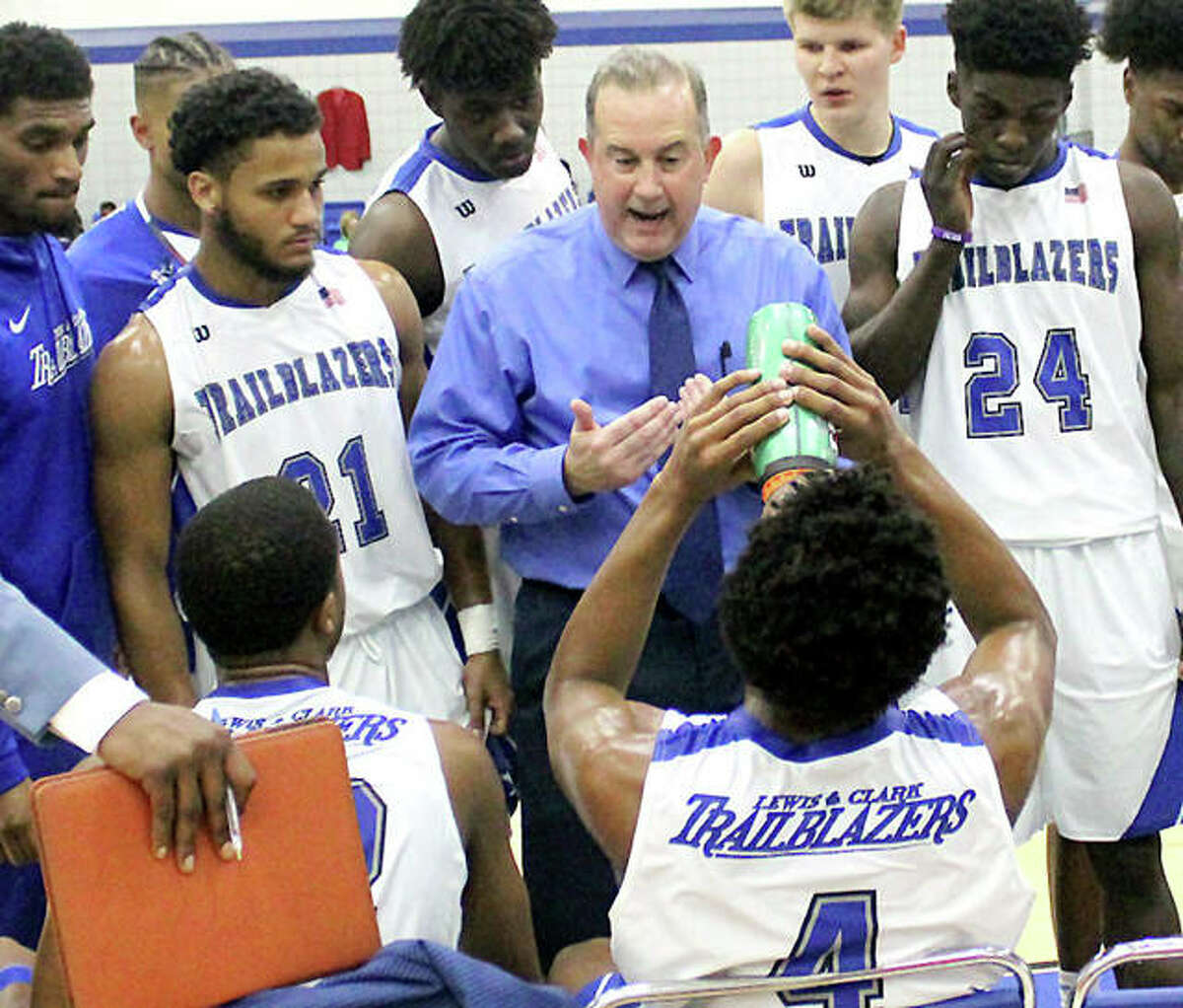 LCCC men’s basketball coach Doug Stotler gives his team instructions during the team’s home opener against Wabash Valley.