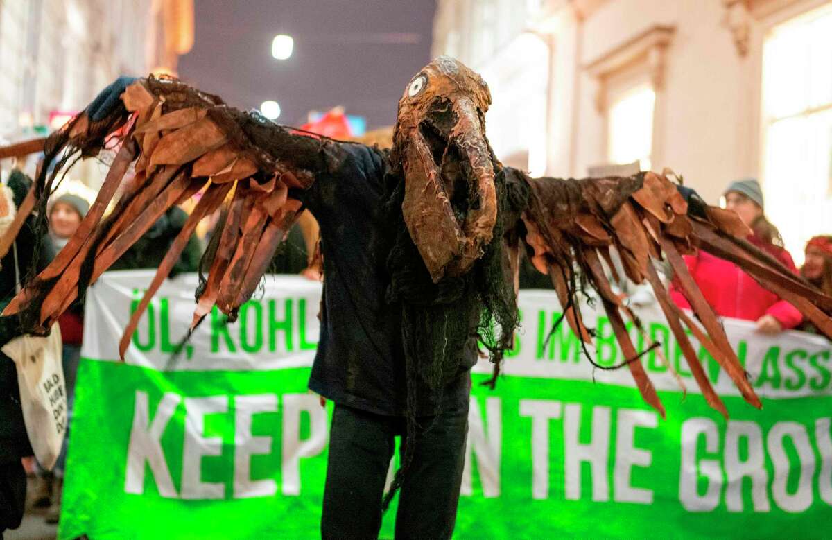 A demonstrator dressed as a bird attends a 'Fridays For Future' demonstration aimed against the meeting of Organization of the Petroleum Exporting Countries (OPEC) on December 6, 2019 in Vienna, Austria. (Photo by JOE KLAMAR / AFP) (Photo by JOE KLAMAR/AFP via Getty Images)