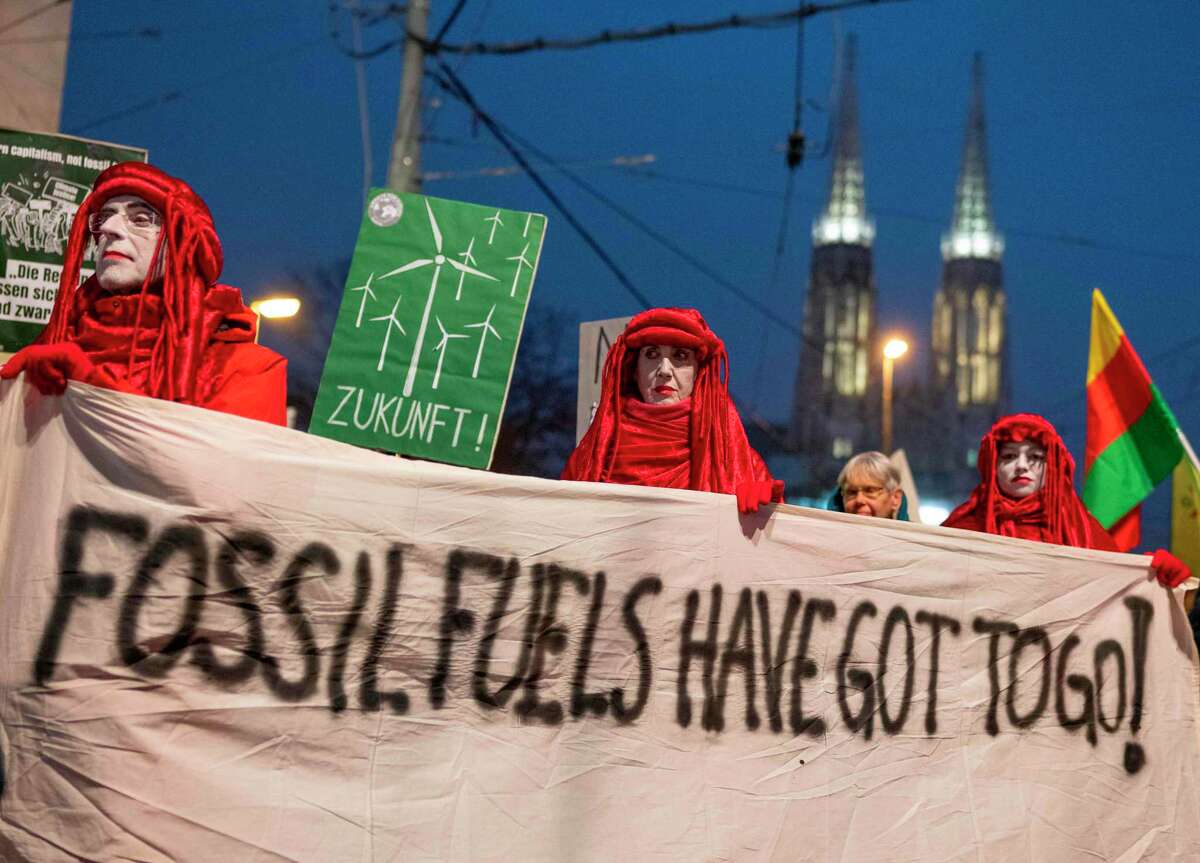 Demonstrators hold a banner as they attend a 'Fridays For Future' demonstration aimed against the Meeting of Organization of the Petroleum Exporting Countries (OPEC) on December 6, 2019 in Vienna, Austria. (Photo by JOE KLAMAR / AFP) (Photo by JOE KLAMAR/AFP via Getty Images)