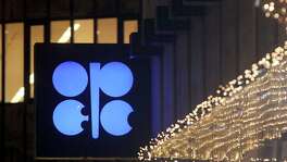 The advertising label of the Organization of the Petroleum Exporting Countries, OPEC, shines at their headquarters in Vienna, Austria, Thursday, Dec. 5, 2019. The countries that make up the OPEC oil-producing cartel are meeting Thursday to decide whether to cut production in order to support the price of fuel and energy around the world. (AP Photo/Ronald Zak)
