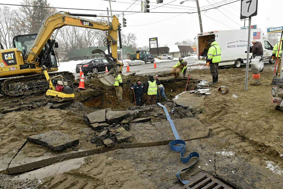 Crews continue to work on a water main break at the five corners near McDonald's on Friday, Dec. 6, 2019 in Rotterdam, N.Y. (Lori Van Buren/Times Union)