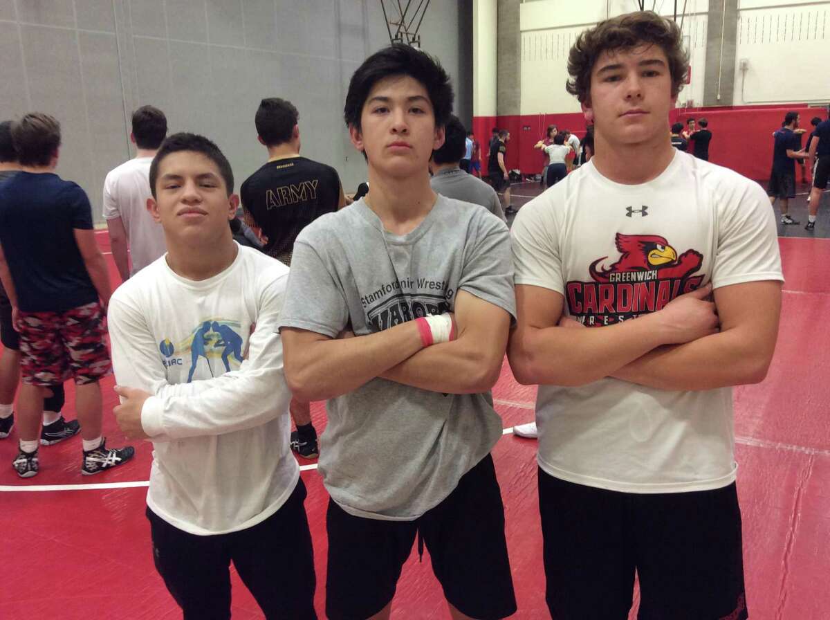 From left to right, Carlos DeWinter, Emanuel Lai and Vincent Ceci are captains of the Greenwich wrestling team.