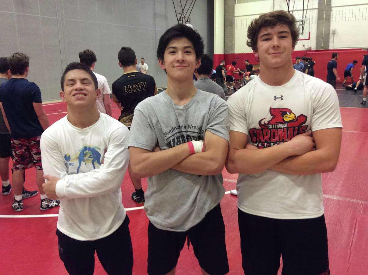 From left to right, Carlos DeWinter, Emanuel Lai and Vincent Ceci are captains of the Greenwich wrestling team.