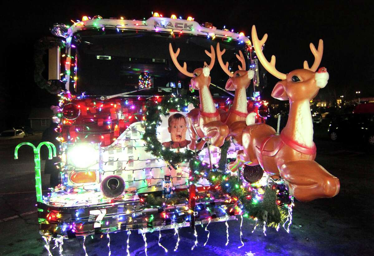 Santa's "sleigh" is the Long Hill Fire Department Christmas truck on display during the annual holiday tree lighting event at Town Hall Green in Trumbull, Conn., on Friday Dec. 6, 2019.