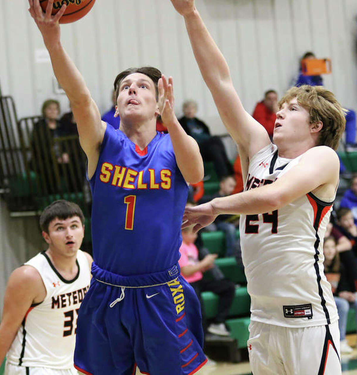 Roxana’s Drew Beckman (1) scored 23 points in his team’s 61-47 victory over the Carrollton Hawks Friday night in Carrollton. He is shown in a game earlier this season against Marissa.