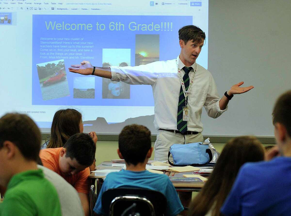 Sixth-grade teacher Todd Stentiford talks to his at Reed Intermediate School in Newtown Monday, August 28, 2017, the first day of school.