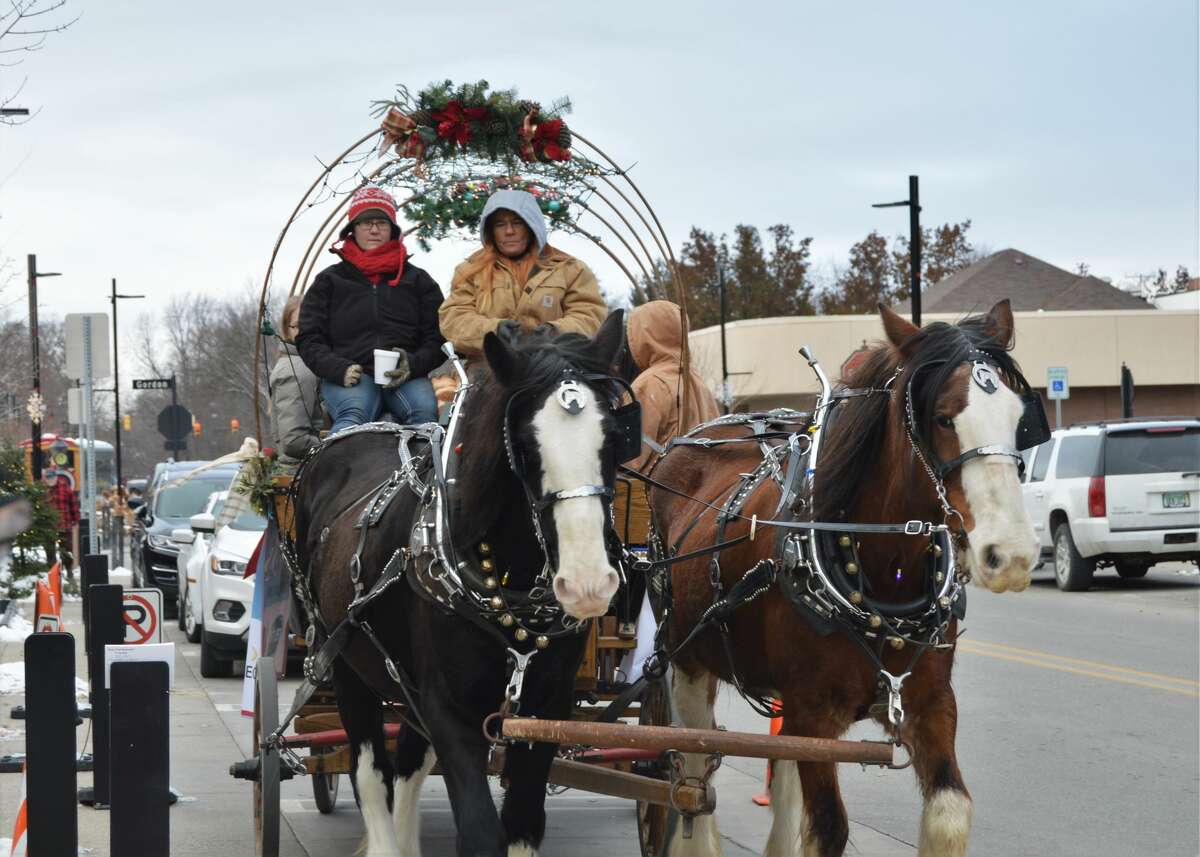 Holly Jolly Days took place this weekend in downtown Midland, offering the community free carriage rides, train rides, hot cocoa, Santa House visits, a TubaChristmas concert, and more. The event continues Dec. 14 and 15 as well. (Ashley Schafer/Ashley.Schafer@hearstnp.com)
