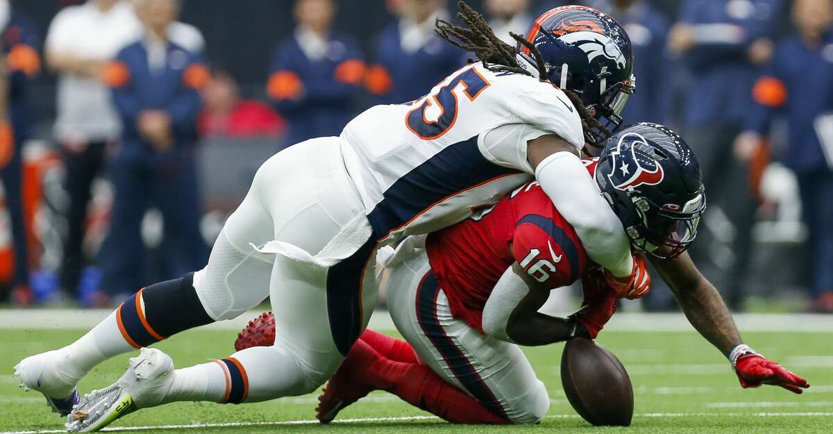 Denver Broncos linebacker A.J. Johnson (45) forces Houston Texans wide receiver Keke Coutee (16) to fumble the ball after a reception during the first quarter of an NFL game at NRG Stadium Sunday, Dec. 8, 2019, in Houston.