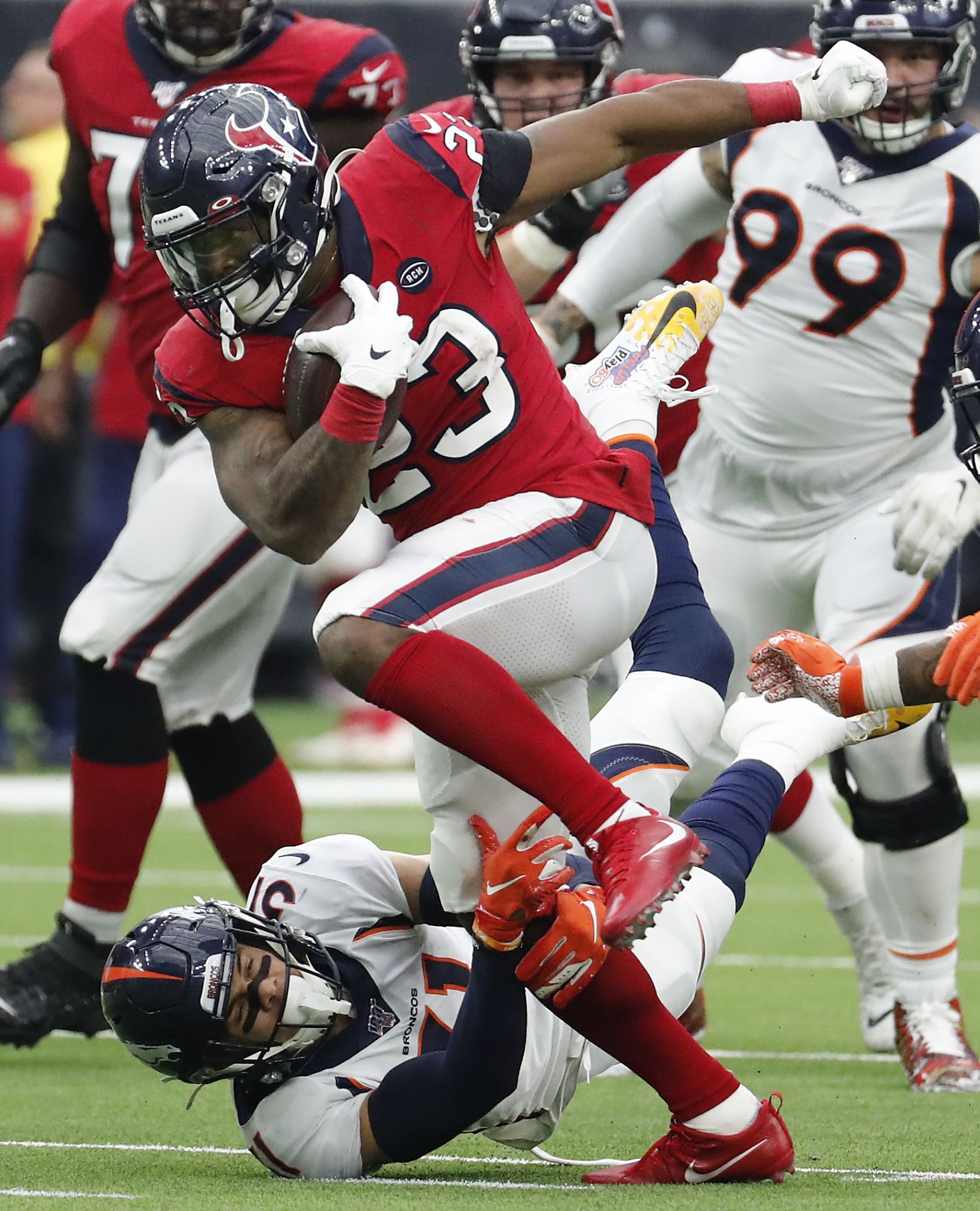 Houston, Texas, USA. 8th Dec, 2019. Denver Broncos linebacker Von Miller  (58) talks with Houston Texans running back Duke Johnson Jr. (25) after a  play during the NFL regular season game between