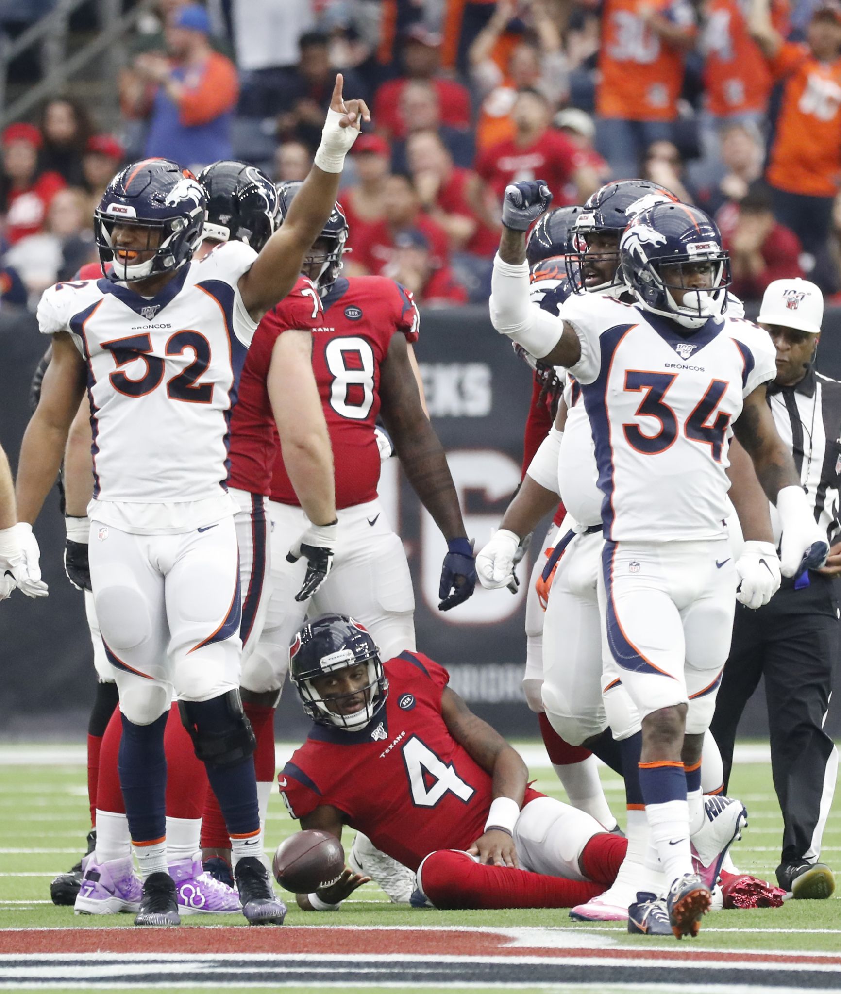 Houston, Texas, USA. 8th Dec, 2019. Denver Broncos linebacker Von Miller  (58) talks with Houston Texans running back Duke Johnson Jr. (25) after a  play during the NFL regular season game between