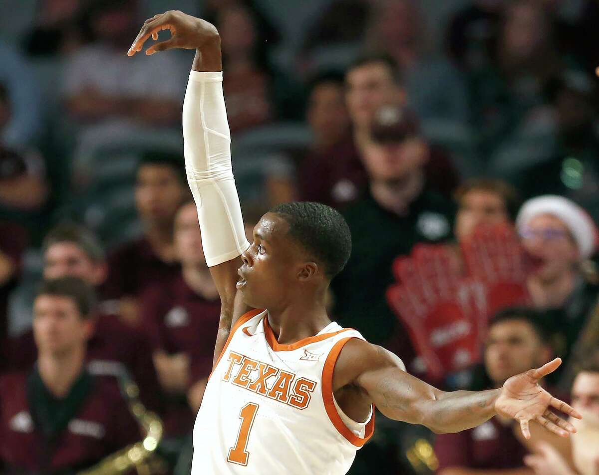 Texas guard Andrew Jones watches a 3-pointer fill the net during the Longhorns’ 60-50 victory over Texas A&M at Fort Worth on Sunday.