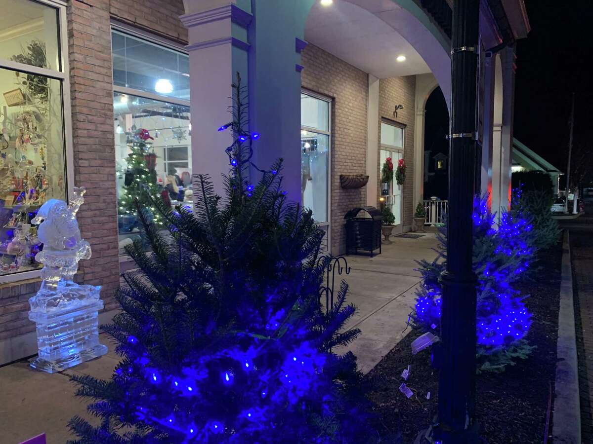 Christmas trees and an ice sculpture at the Brick Walk tree lighting.