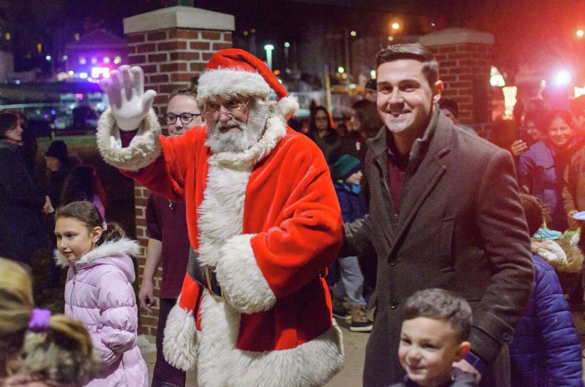 Santa Claud was greeted by Jimmy Tickey, right, at the Celebrate Shelton's annual tree lighting in 2019. This year's tree lighting will be Friday, Dec. 4, at 6:30 p.m. at the Rotary Pavilion at Veteran's Memorial Park.