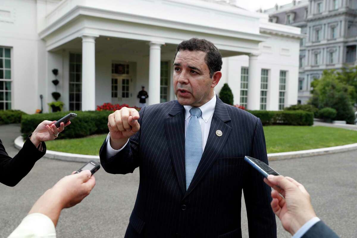 FILE - In this Sept. 13, 2017 file photo, Rep. Henry Cuellar, D-Texas, speaks with reporters outside the West Wing after a bipartisan meeting with President Donald Trump at the White House. (AP Photo/Alex Brandon, File)