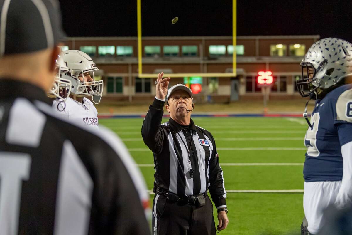 The referee tosses the coin to start the quarterfinal match between the Silsbee Tigers and the Mustangs of West Orange-Starke on Friday night at BISD Memorial Stadium. Fran Ruchalski/The Enterprise