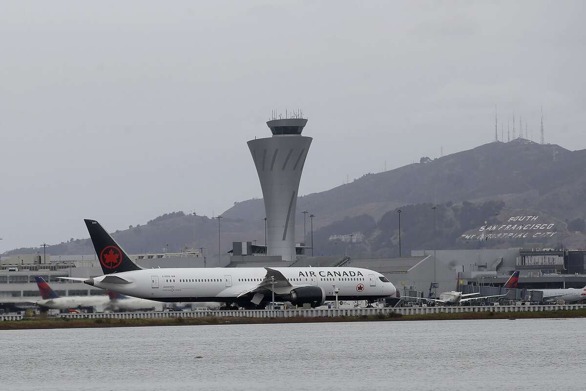 An Air Canada plane prepares to take off from San Francisco International Airport in San Francisco, Tuesday, November 26, 2019 (AP Photo/Jeff Chiu)