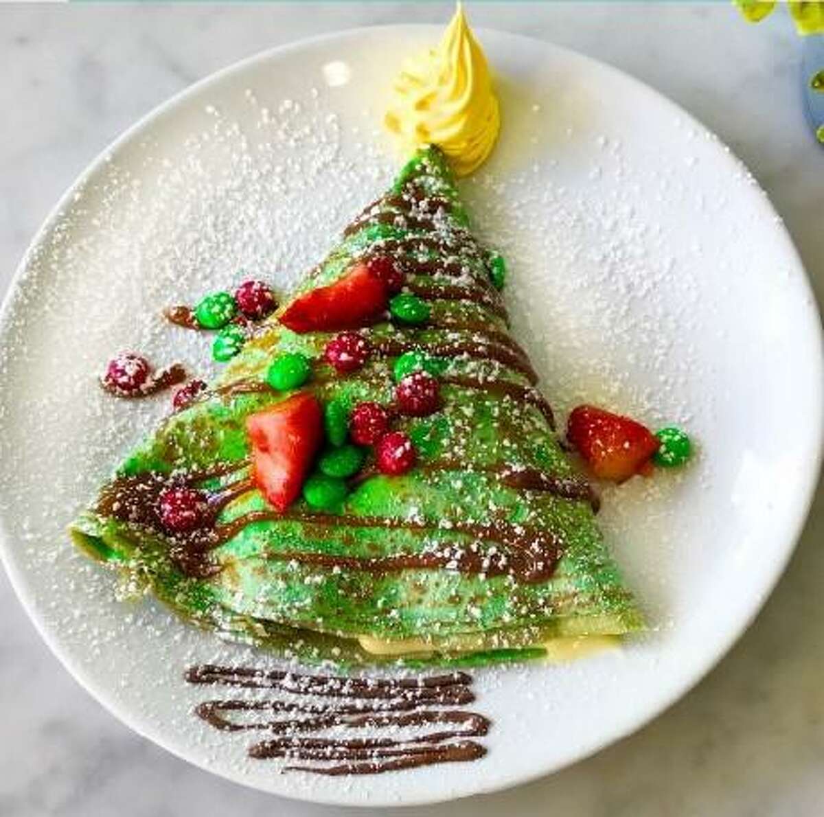 Eating at local restaurants and eateries helps support the Houston economy and create jobs. Right now, Sweet Paris Creperie and Cafe is serving The Grinch crepe.