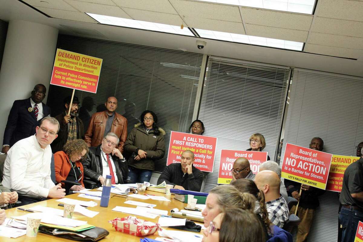 Protesters and the parents of deceased 23-year-old Steven Barrier call on city leaders for more information and an emergency meeting for the Board of Representatives while at the Steering Committee's Dec. 9 meeting in the fourth floor of Government Center.