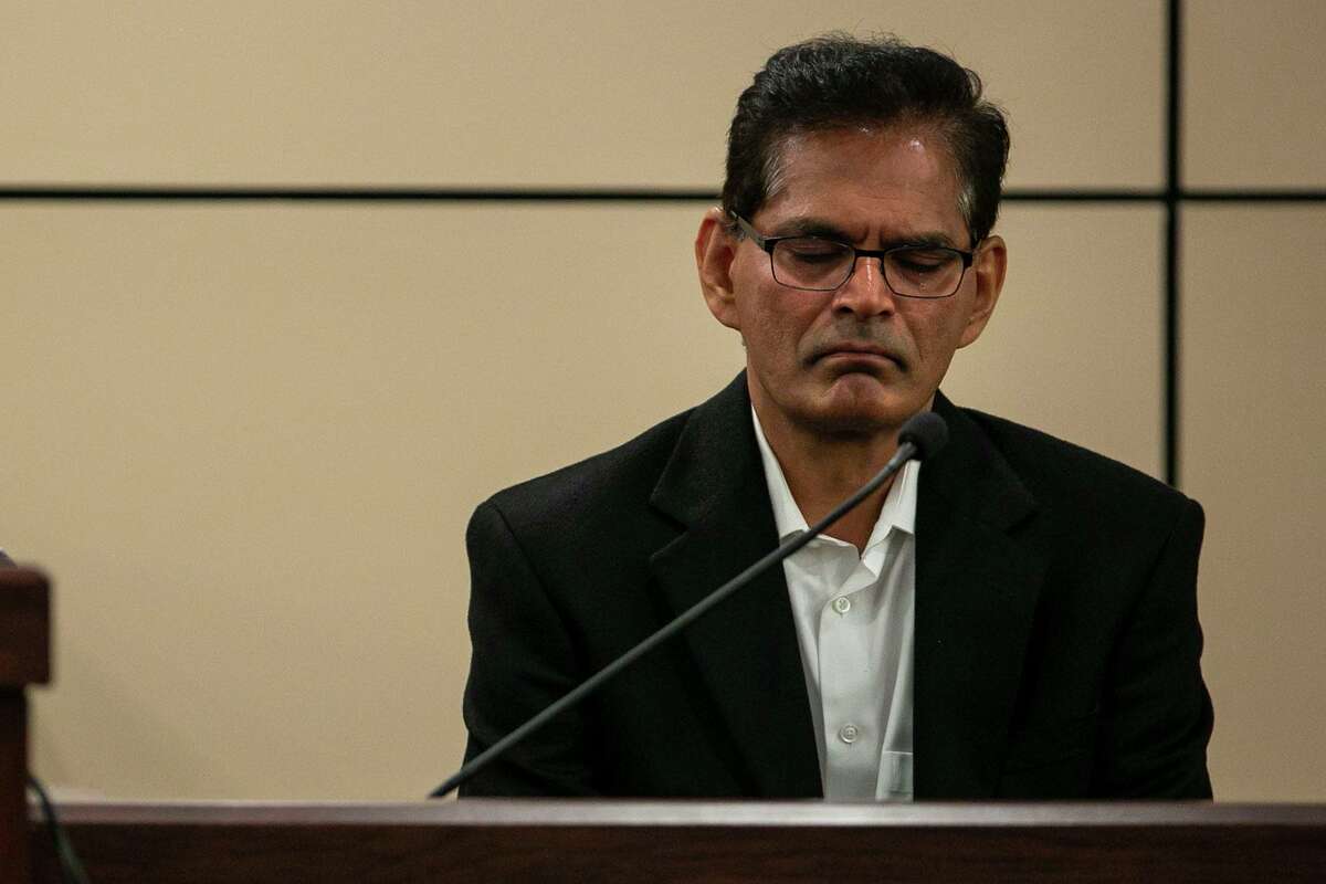 Tilak Mandadi takes a moment after identifying a photo of his daughter, Cayley Mandadi, as he testifies in the murder trial of Mark Howerton, of Tyler. Howerton is accused of killing Mandadi, a 19-year-old Trinity University student and cheerleader, in 2017. The prosecution rested on Monday, Dec. 9, 2019.