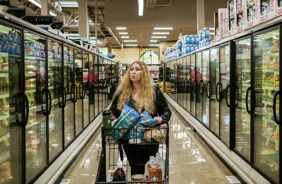 Instacart shopper Vanessa Bain shops for a customer at a Safeway in Menlo Park, California, on Nov. 14, 2019.