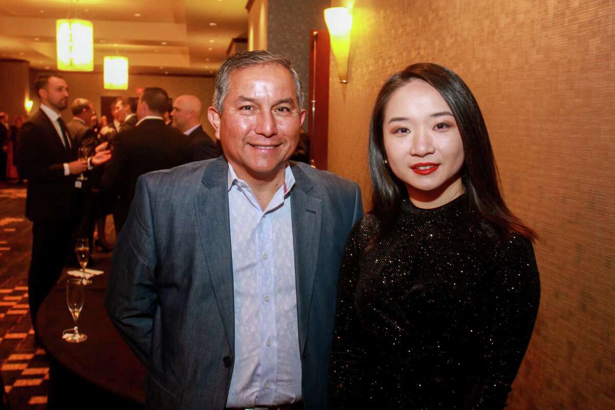 Ralph Castellano and Amanda Hu at Spec's Vintage Virtuoso hosted by Spec's Charitable Foundation, and benefiting the Houston Symphony, at Royal Sonesta Hotel on December 4, 2019.