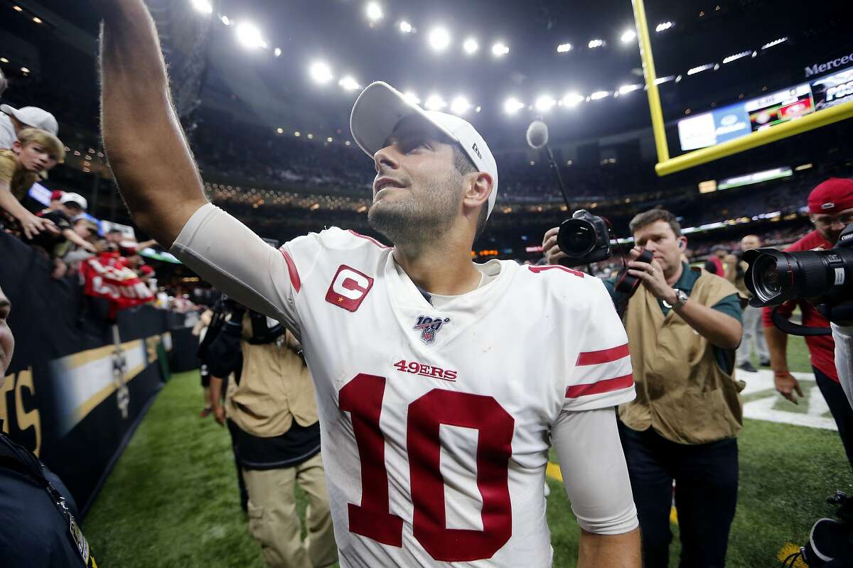 San Francisco 49ers quarterback Jimmy Garoppolo (10) grew fans as he walks off the field after an NFL football game against the New Orleans Saints in New Orleans, Sunday, Dec. 8, 2019. The 49ers won 48-46. (AP Photo/Brett Duke)