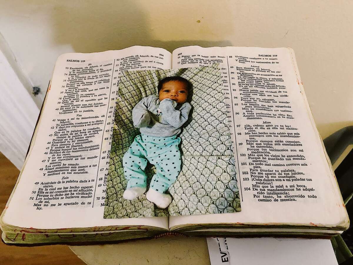 A photo of LaBoy’s child, Naveah, sits atop a bible at her mother Karine Laboy’s New Britain home.