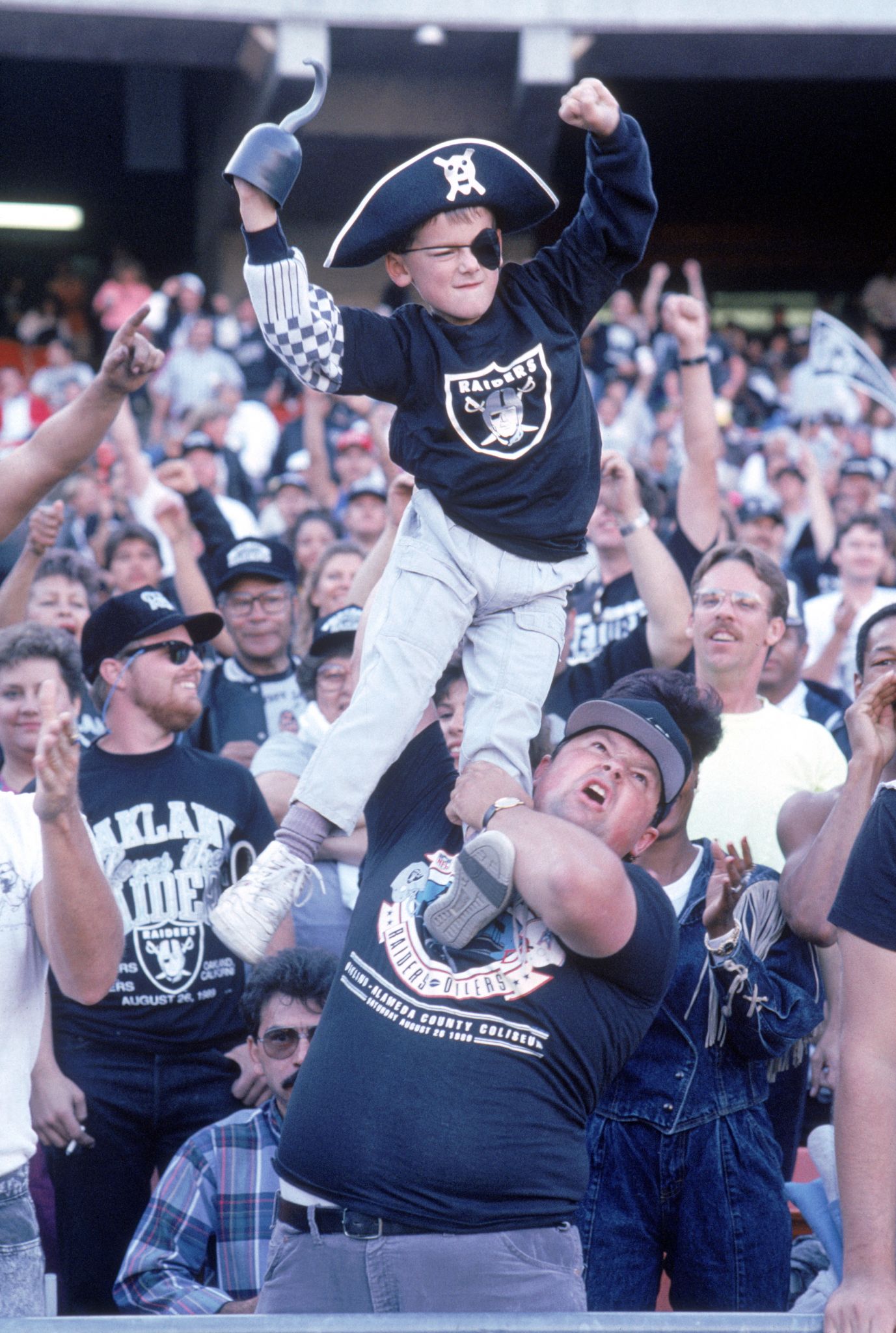 An NFL fan celebrates the return of the Raiders in this 1995 Oakland