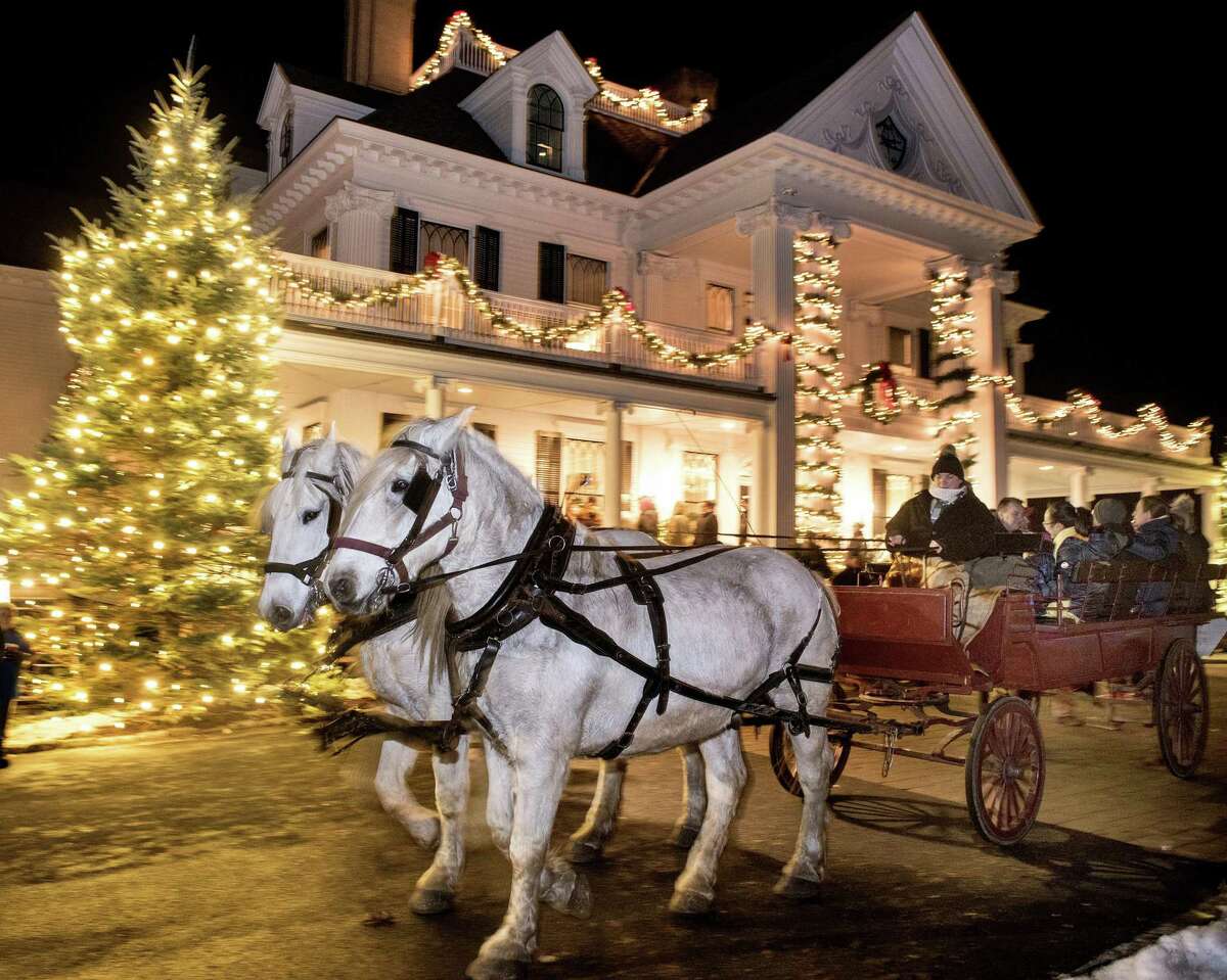 Visitors to the Ridgefield Holiday Stroll rode horse-drawn carriages on Friday, Dec. 6, 2019 in Ridgefield, Conn. Visitors to the Ridgefield Holiday Stroll rode horse-drawn carriages on Friday, Dec. 6, 2019. A four-weekend series of events designed to spread out the crowds amid the COVID-19 pandemic has now been canceled.