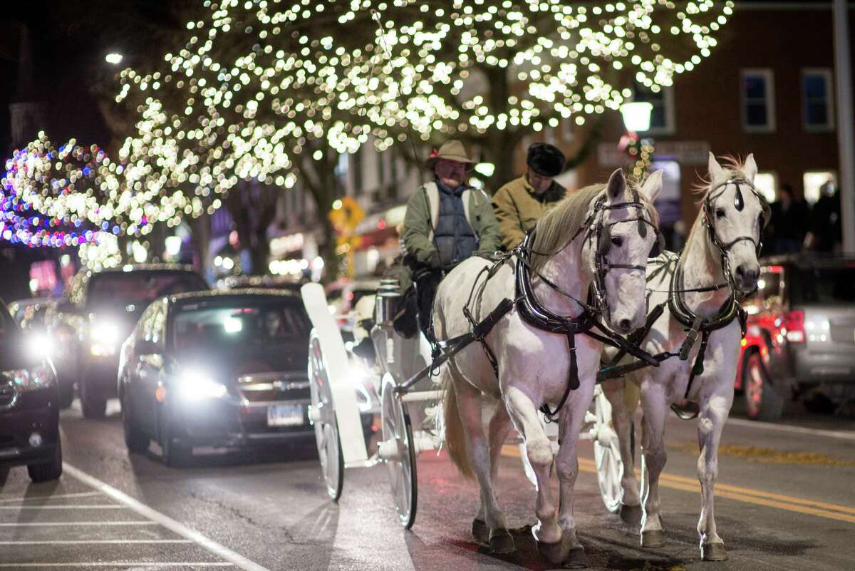 Ridgefield's Holiday Stroll offered visitors horse carriage rides, shopping, ice sculptures, a visit from Santa and plenty of holiday lights on Friday, Dec. 6, 2019 in Ridgefield, Conn.