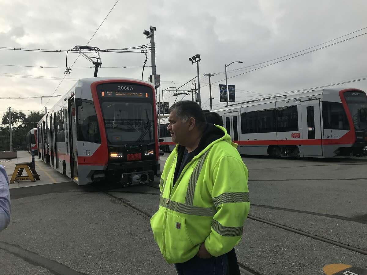 Test supervisor Emmanuel Enriquez stands in front of Car No. 2068, the last vehicle in Muni's first rollout of new trains.