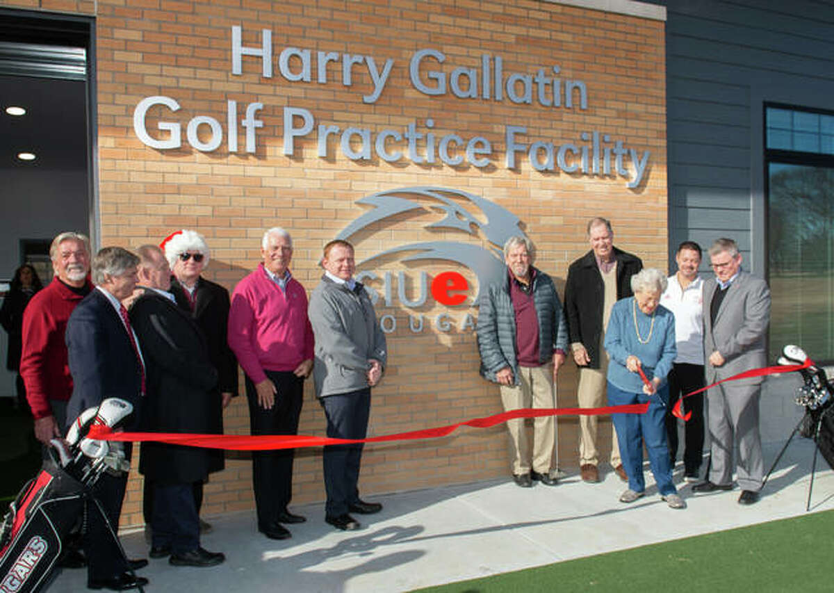 Bev Gallatin cuts the ribbon at the dedication of the new Harry Gallatin SIUE Golf Practice Facility at Sunset Hills Country Club in Edwardsville.