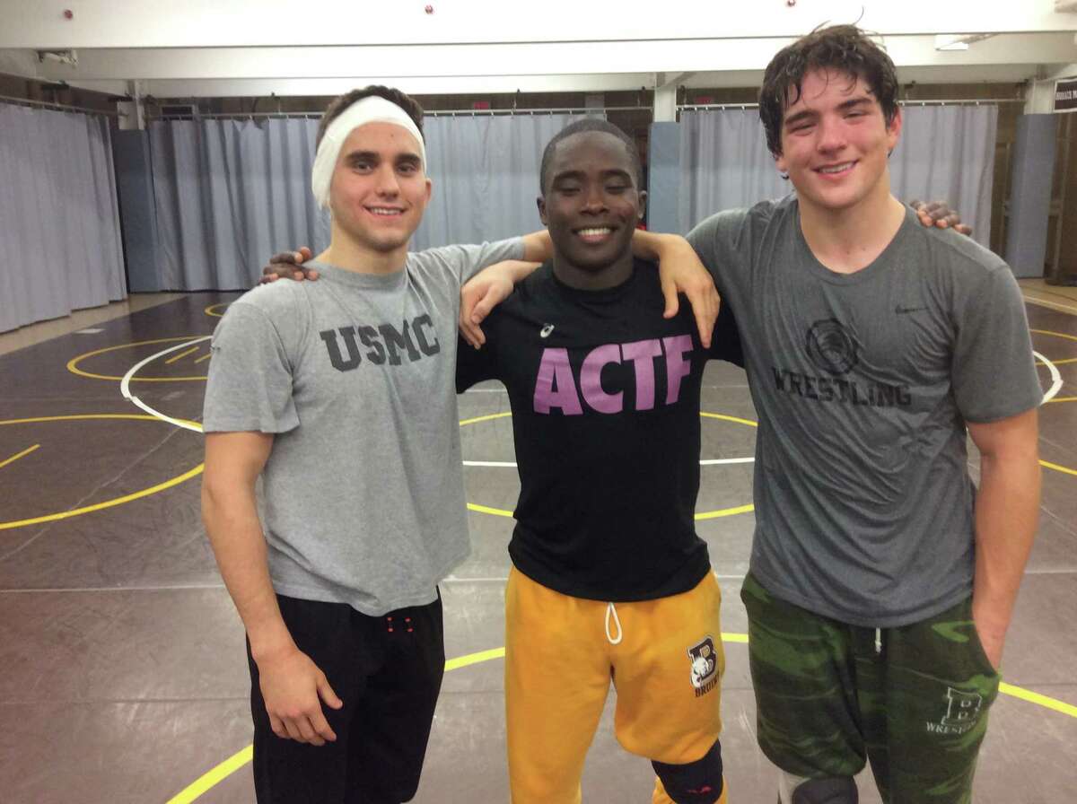 From left to right: Luca Errico, Nadji Ngbokoli and Clayton Ostrover are senior captains of the Brunswick School wrestling team.