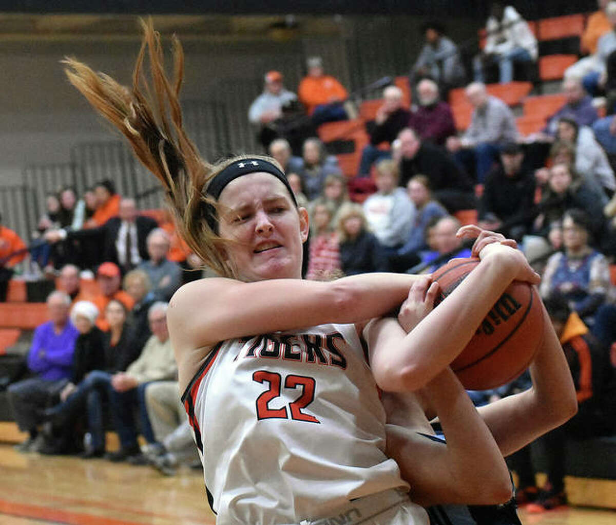 Edwardsville center Katelynne Roberts fights for a rebound with a Belleville East player during the first quarter Tuesday in Belleville.