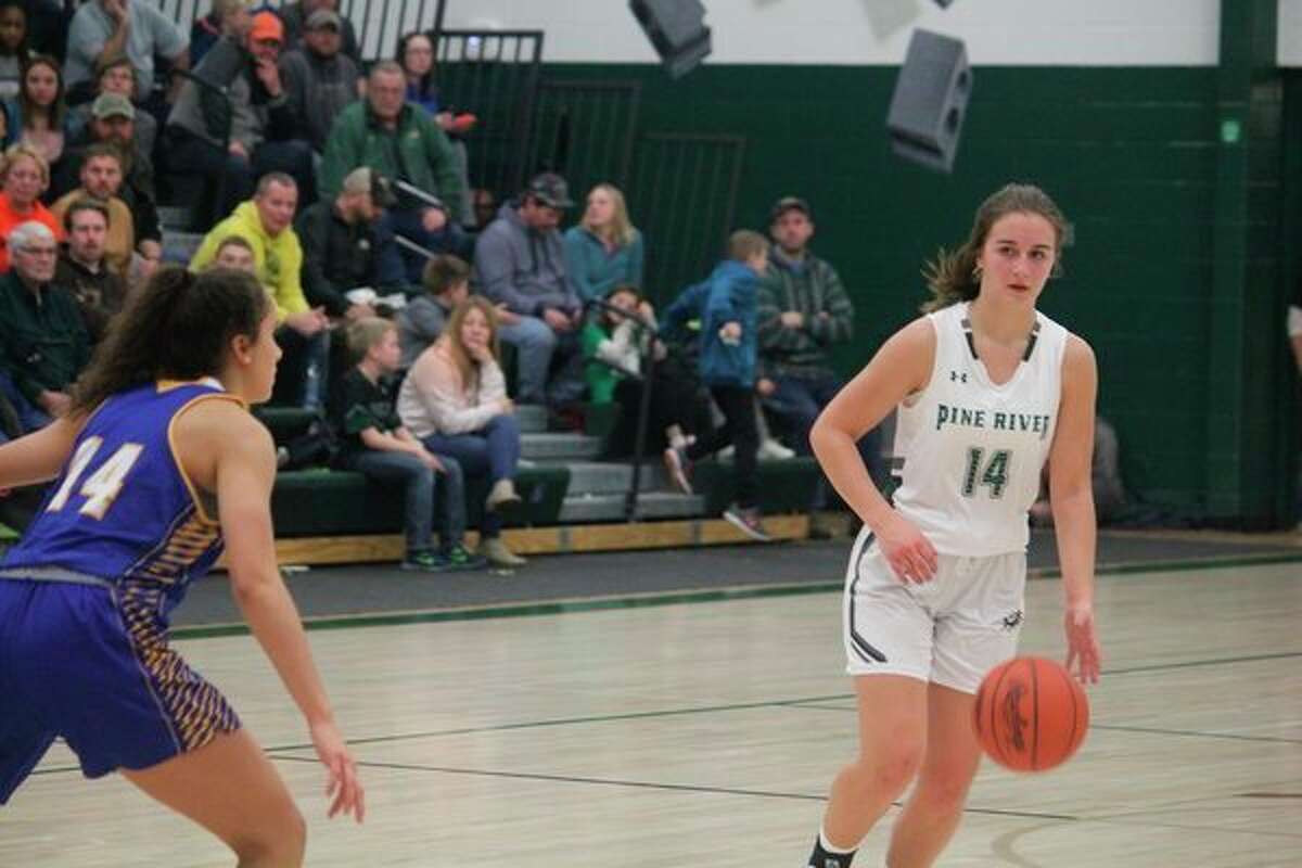 Pine River's Madi Sparks (14) looks to make a move against the Morley Stanwood defense in girls basketball action Dec. 3. (Herald Review photo/John Raffel)