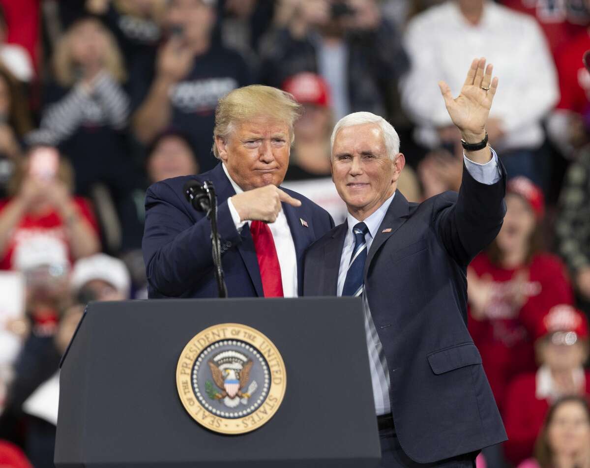 HERSHEY, PA, USA - DECEMBER 10 : U.S. President Donald Trump and U.S. Vice President Mike Pence (R) gesture during a campaign rally on December 10, 2019 at Giant Center in Hershey, Pennsylvania, United States. (Photo by Lev Radin/Anadolu Agency via Getty Images)