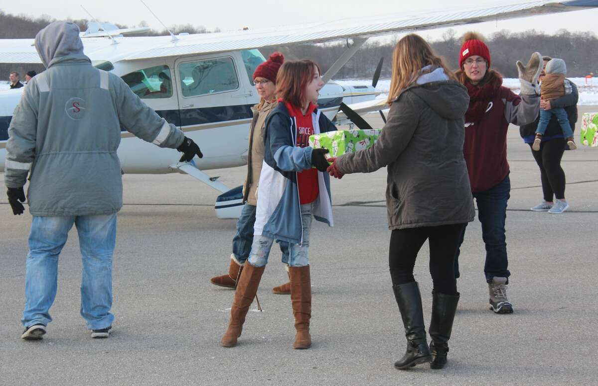 Volunteers unloaded presents from more than 30 planes at Roben-Hood Airport in 2019. Operation Good Cheer is an annual holiday program that helps bring Christmas presents to foster children across the state. This year's delivery will be Saturday, Dec. 4.