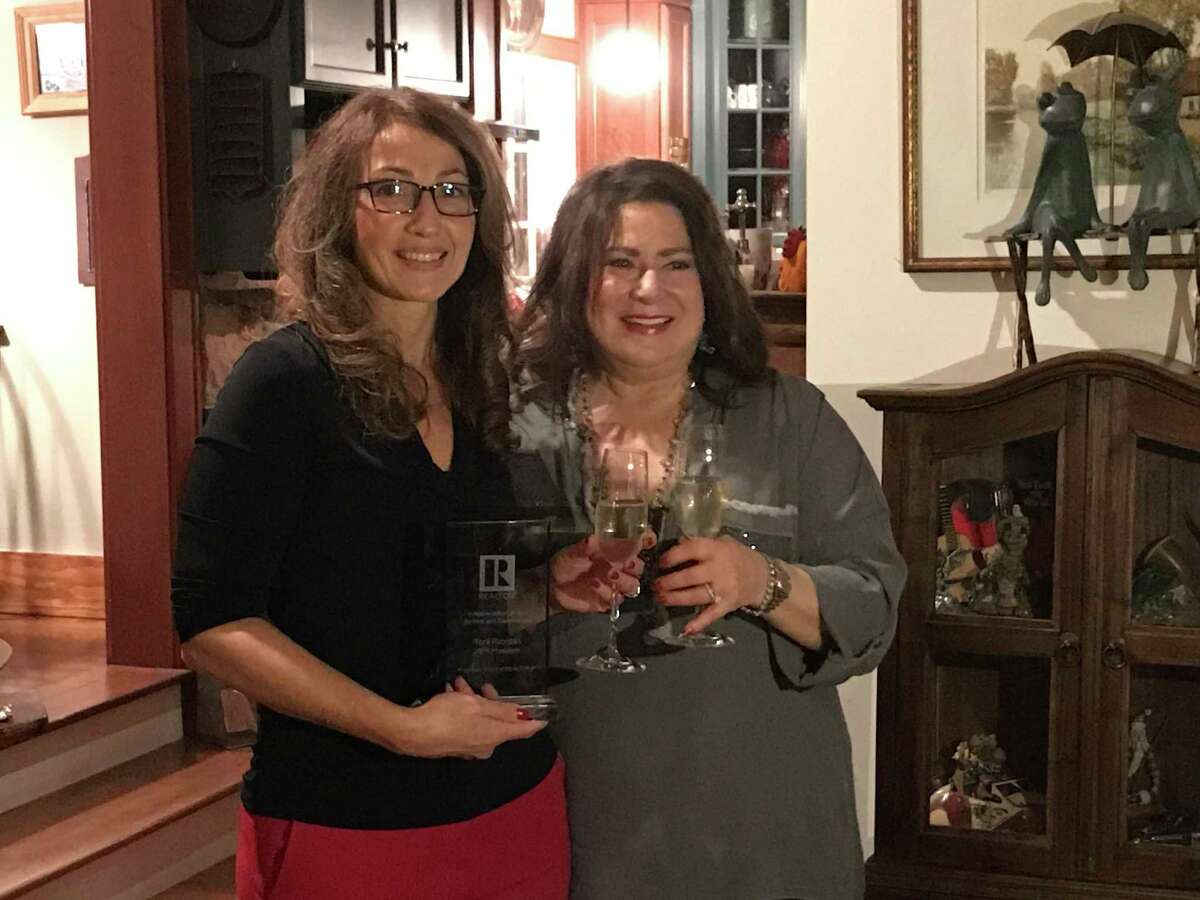 Incoming 2020 RBOR President Lynne Boehm saluted Toni Riordan, 2019 RBOR president, for her commitment and dedication to the association on Dec. 10 at the RBOR Board Appreciation Dinner.