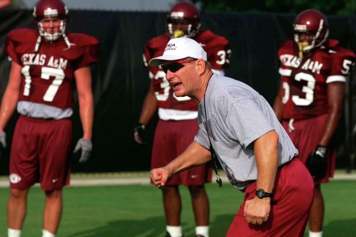 Former Texas A&M University inside linebacker coach Alan Weddell instructs players on drills in 1999 during the first day of practice for the Aggies.