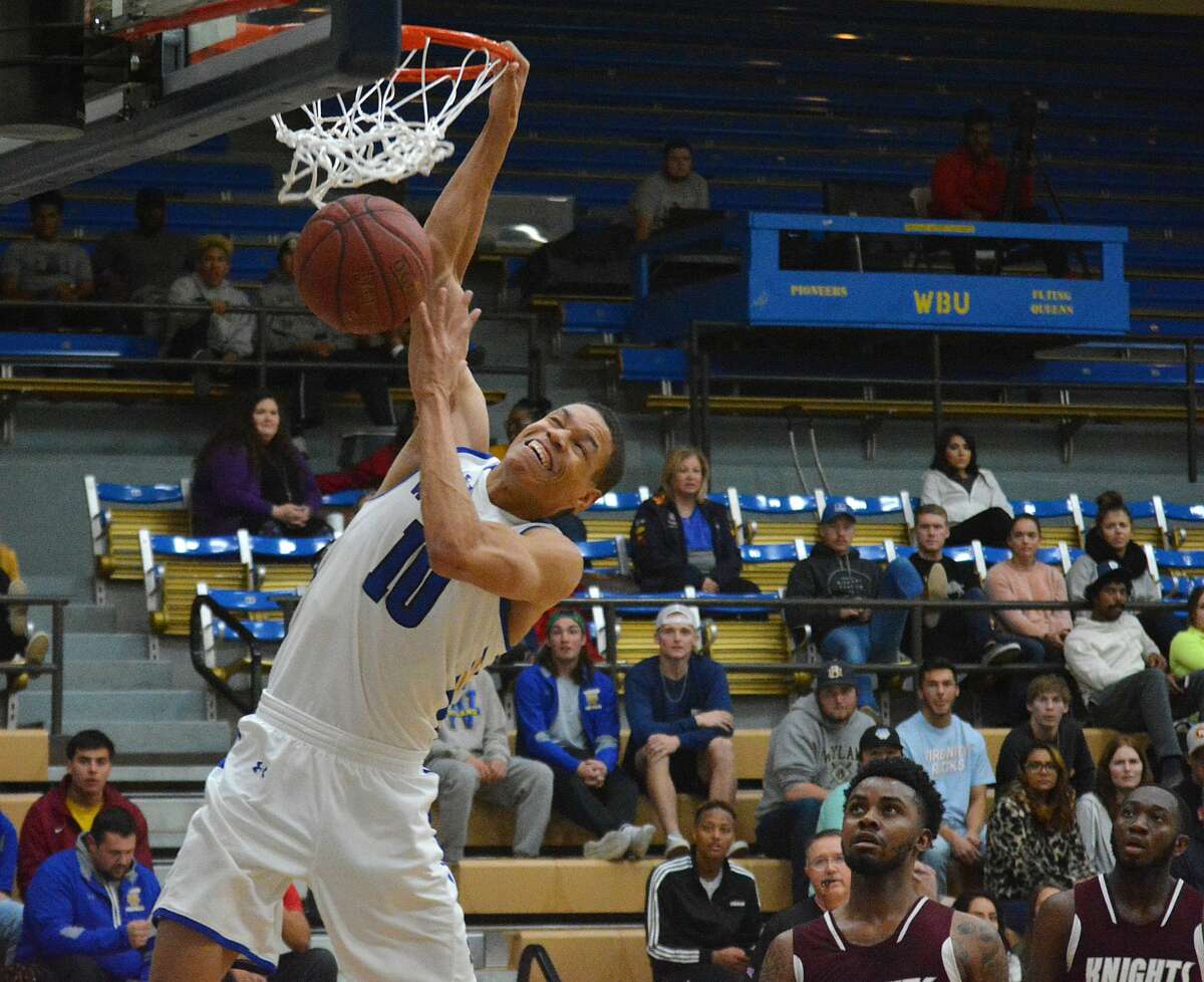 Senior J.J. Culver slams home two of his 100 points during the ninth-ranked Wayland Baptist men’s basketball team’s 124-60 victory over Southwestern Adventist on Tuesday, Dec. 10 in the Hutcherson Center.