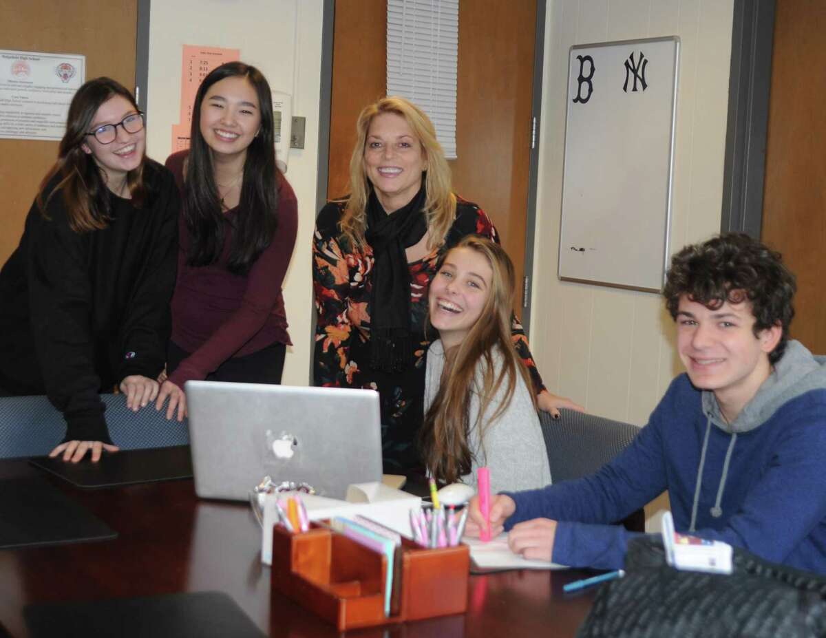 Working with kids is what Dr. Stacey Gross says she’ll miss most about being Ridgefield High School principal. From left are: Evie Langston, Camryn Liem. Dr. Gross, Brooke Manganiello and James Hooker.