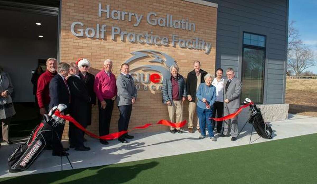 Bev Gallatin cuts the ribbon at the Harry Gallatin SIUE Golf Practice Facility inside the Sunset Hills Country Club in Edwardsville.