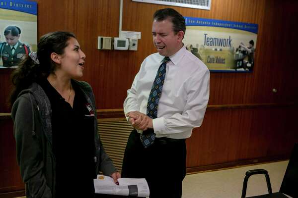 Martinez laughs with Fox Tech High School representative Kristi Jimenez after the meeting with the student advisory panel.