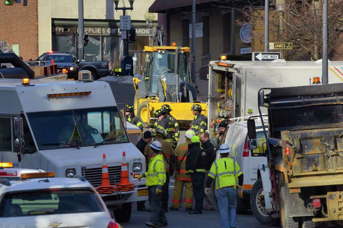 National Grid crews and Albany firefighters work at the scene of a gas leak on James Street on Thursday, Dec. 12, 2019, in Albany, N.Y. Home heating bills are expected to rise 31 percent this winter. (Paul Buckowski/Times Union)