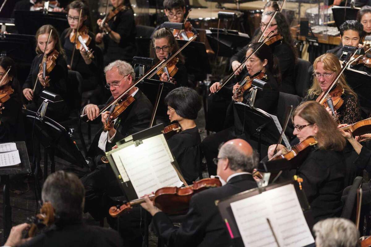 The string section of the New Haven Symphony Orchestra in a previous concert.