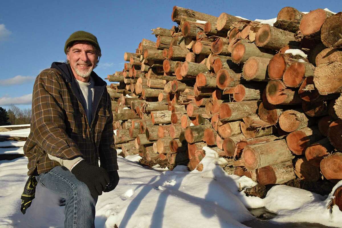 Co-owner Ray Juliano stands in front of pilings used on the old Tappan Zee bridge up for sale at Cooksburg Lumber Company on Wednesday, Dec. 11, 2019 in Preston Hollow, N.Y. The lumberyard currently has nearly 800,000 board feet of these pilings. (Lori Van Buren/Times Union)