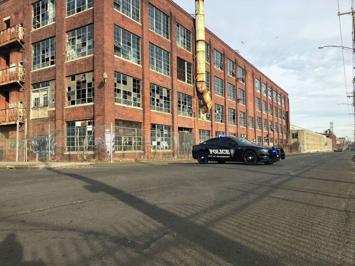 Barnum Avenue was blocked between Helen Street and Seaview Avenue as police investigated the discovery of a body near the former Remington Arms factory Dec. 8, 2019.