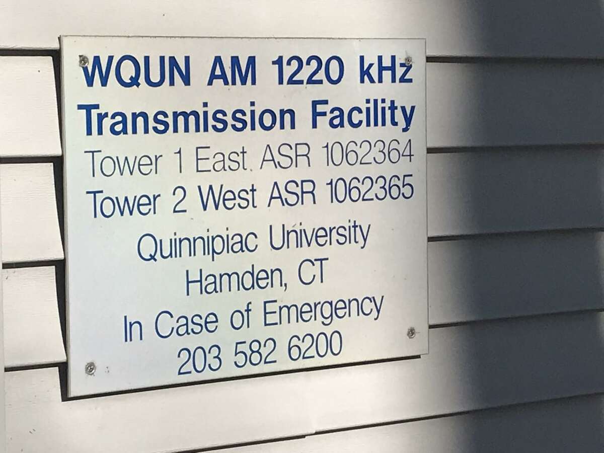 A sign on the side of the former WQUN transmitter building in Hamden.